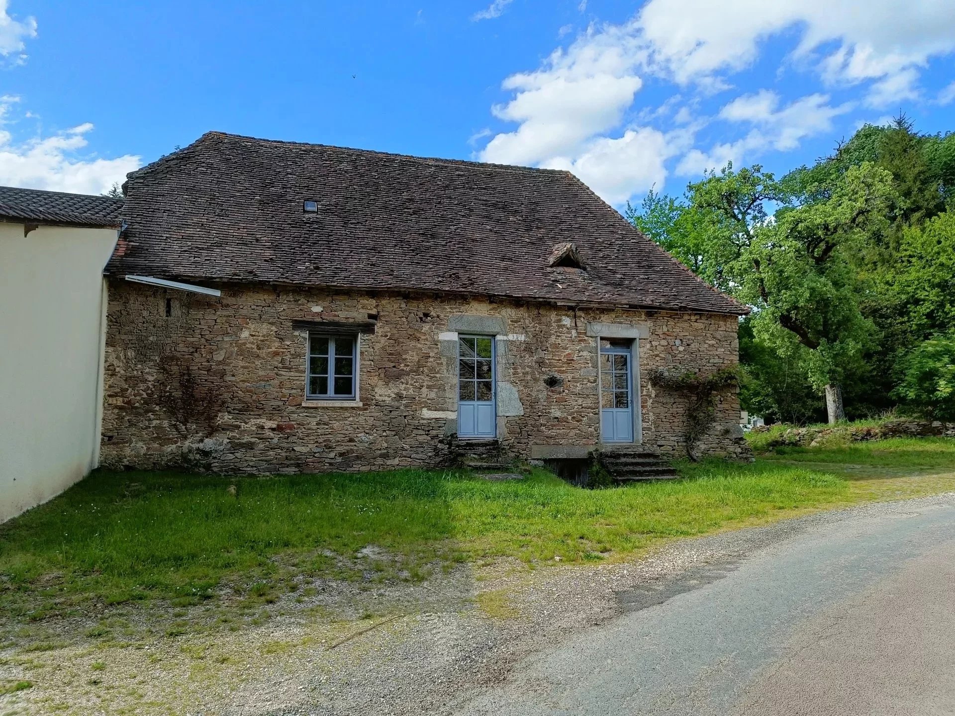 Stone house in need of renovation with barn and land