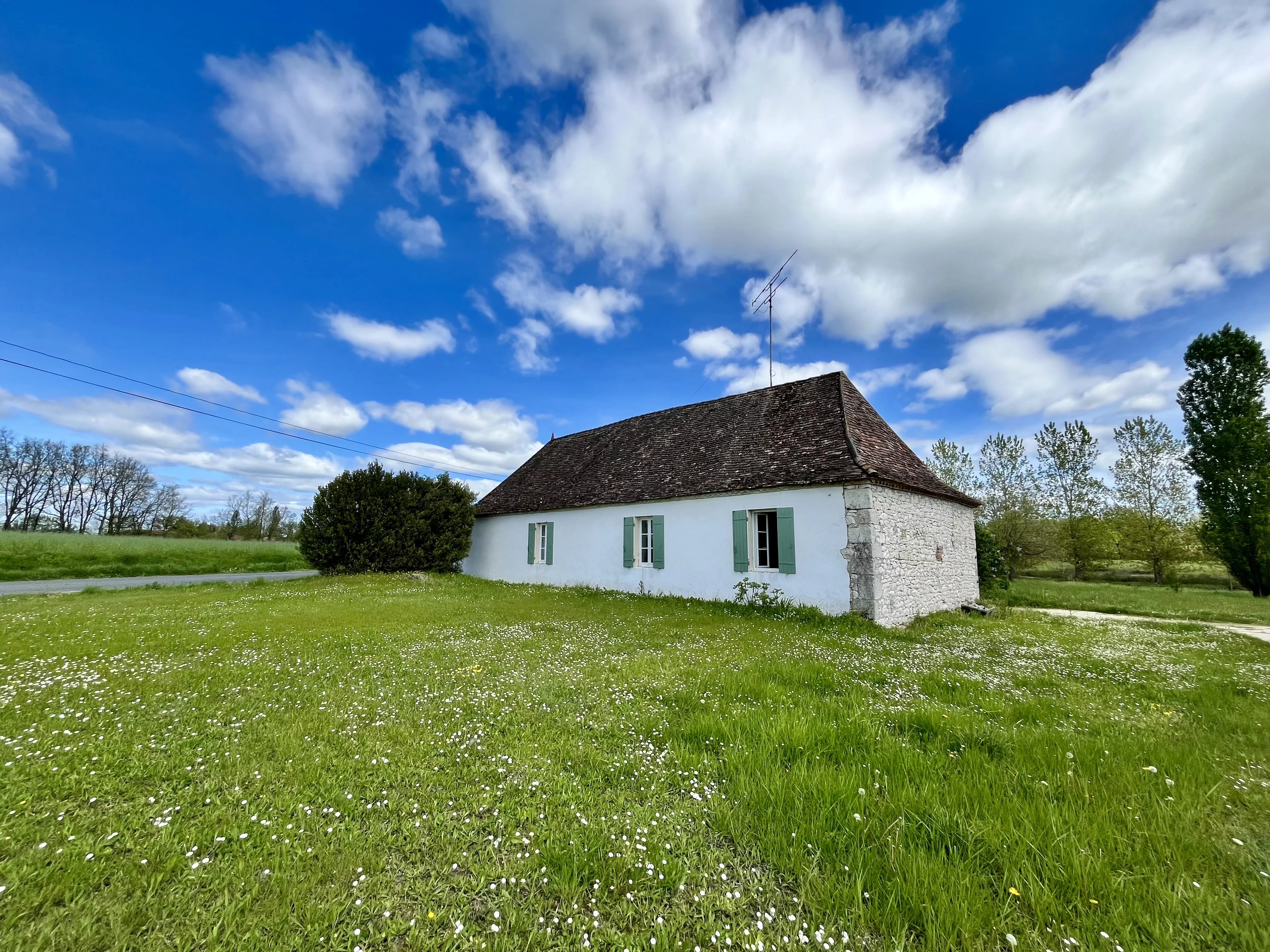 Country stone house with outbuildings and lots of land