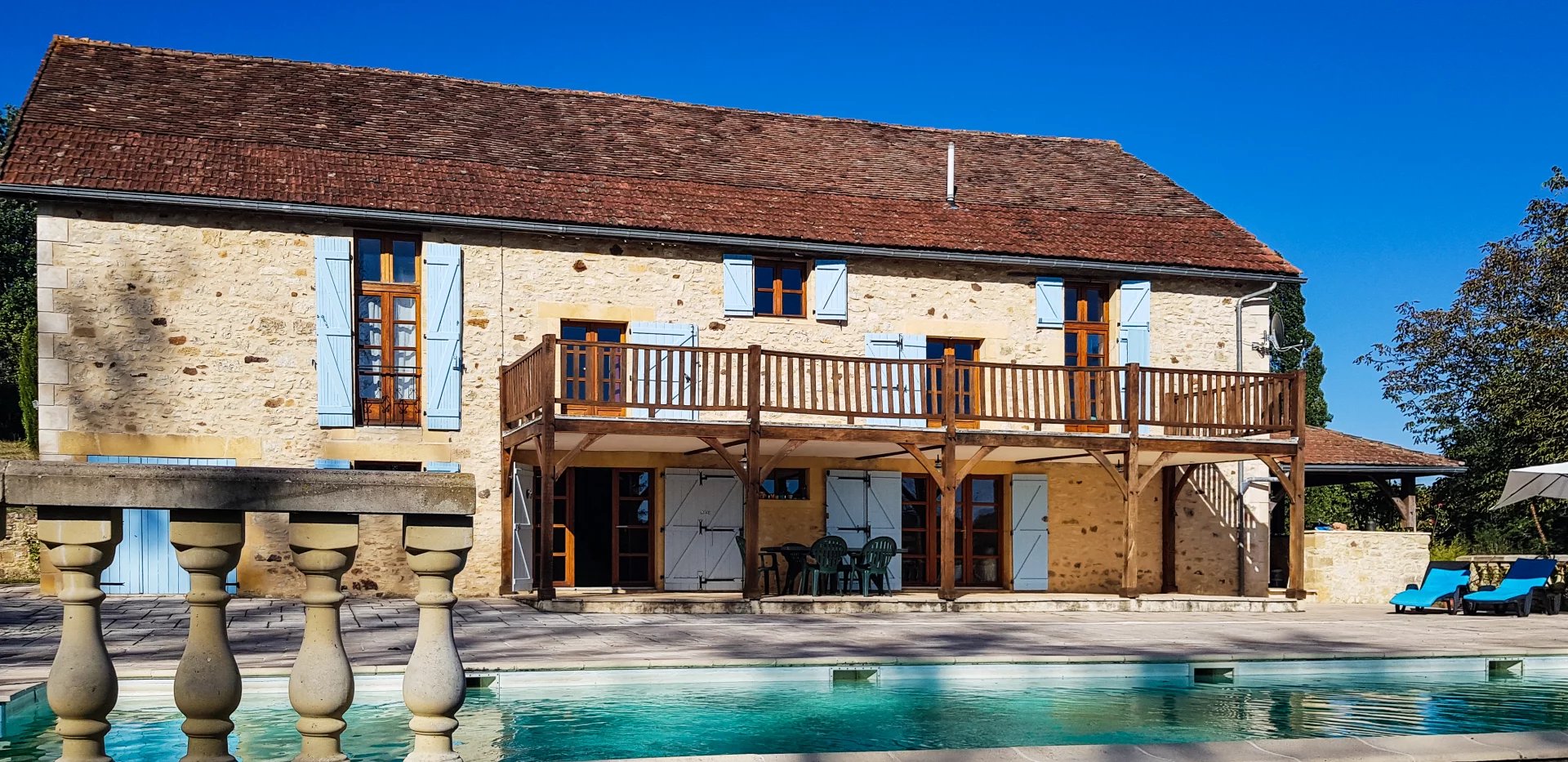 Prestigious barn conversion with pool, guest house and stunning views, 2km from a bustling town.
