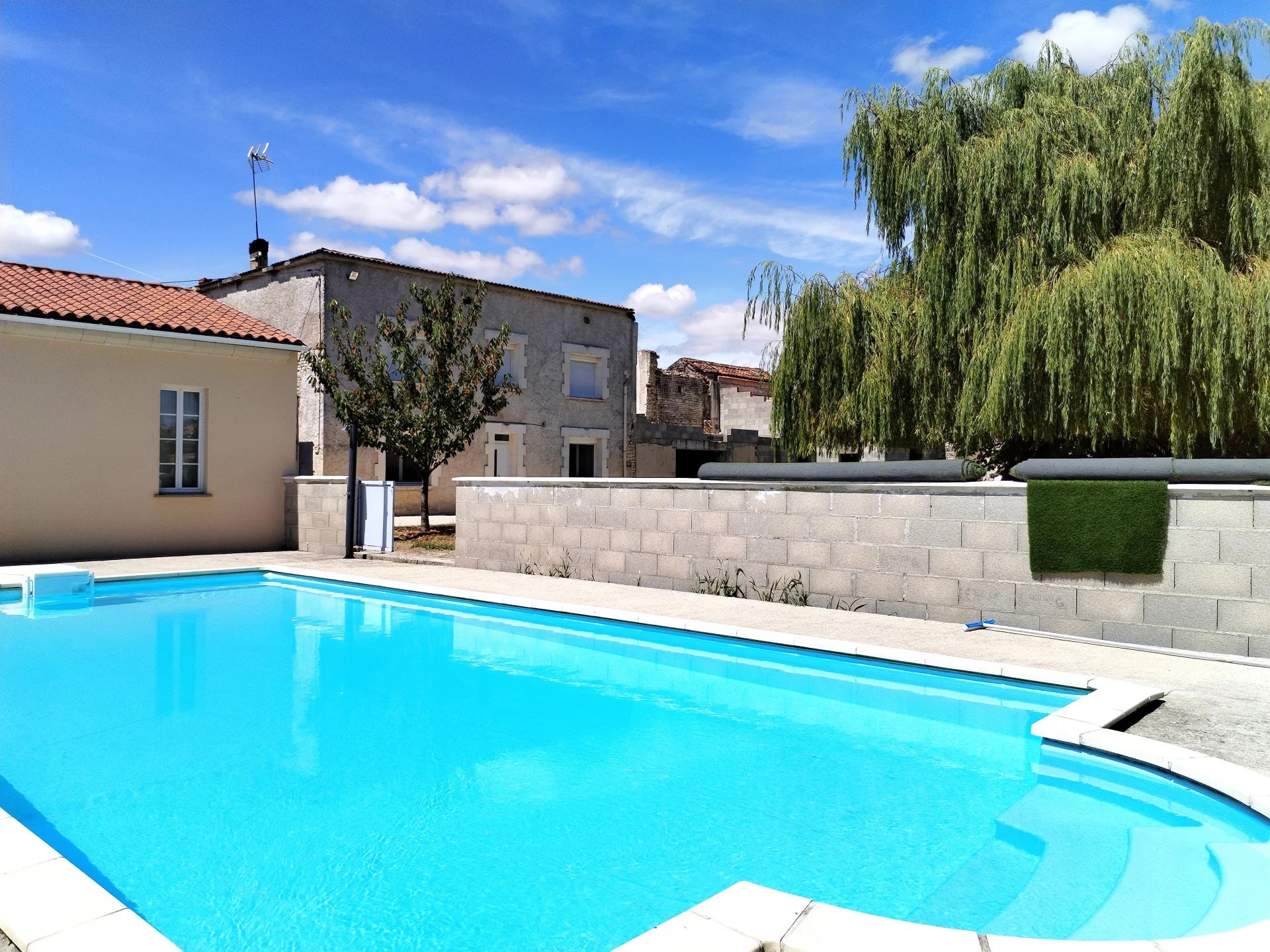 Village house with swimming pool and numerous outbuildings