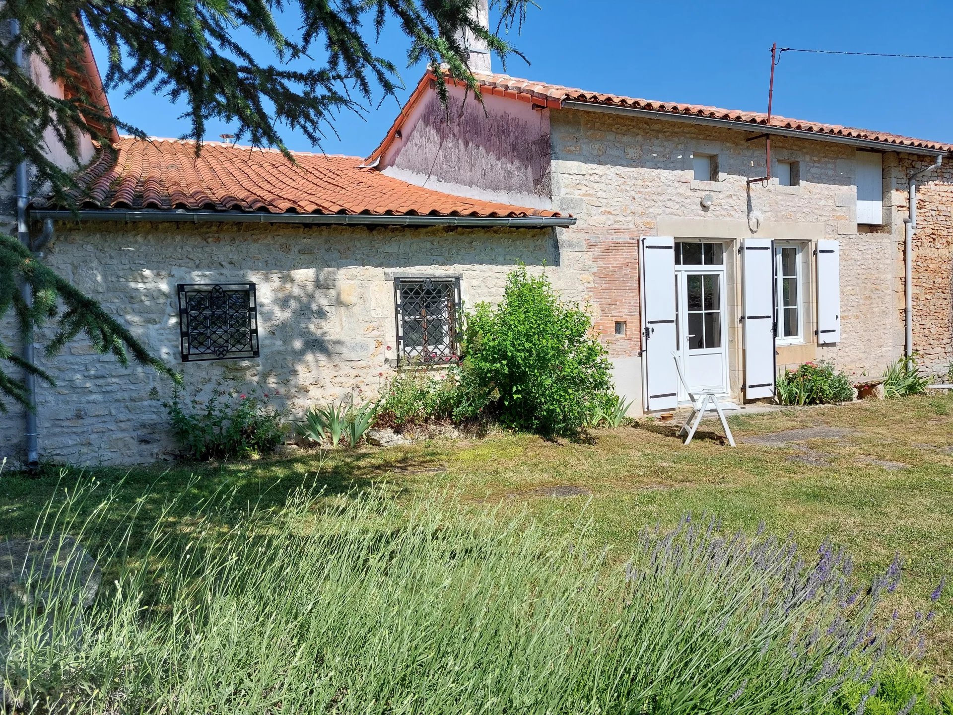 Stunning single storey stone character property with outbuildings - close to Ruffec