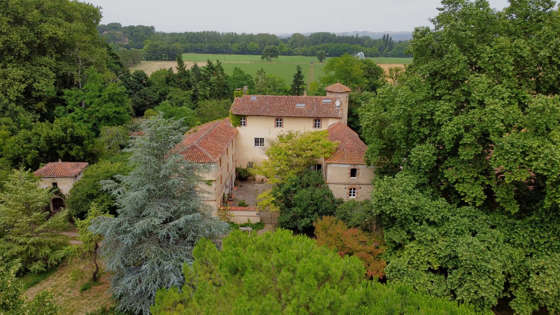 16th Century Chateau with outbuildings and pool, set in nearly 4 ha of land including a wood, and river