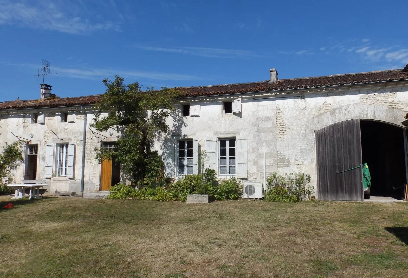 Country house with outbuildings and garden