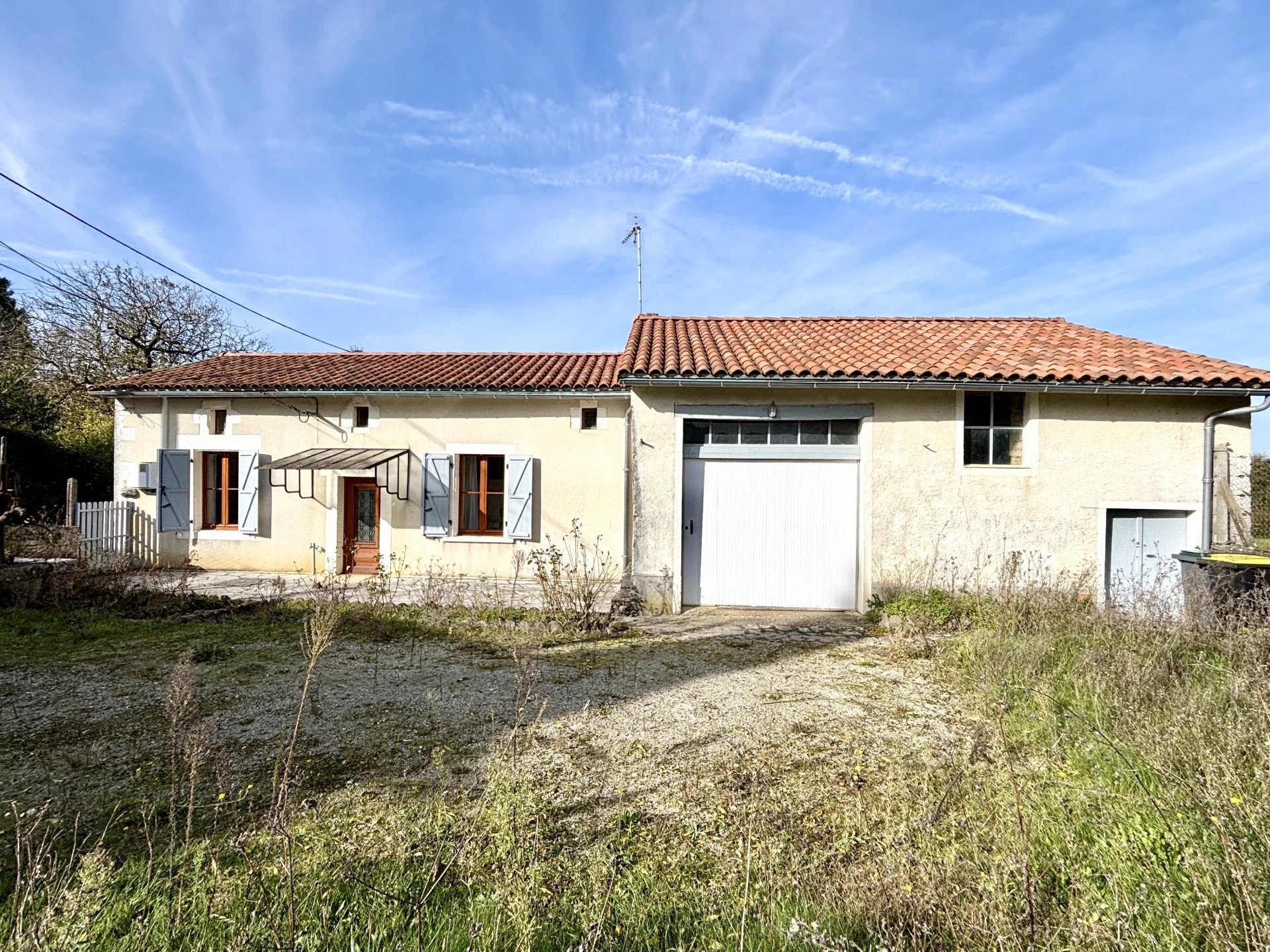 Detached village house with ground floor living, outbuildings and an attached garden