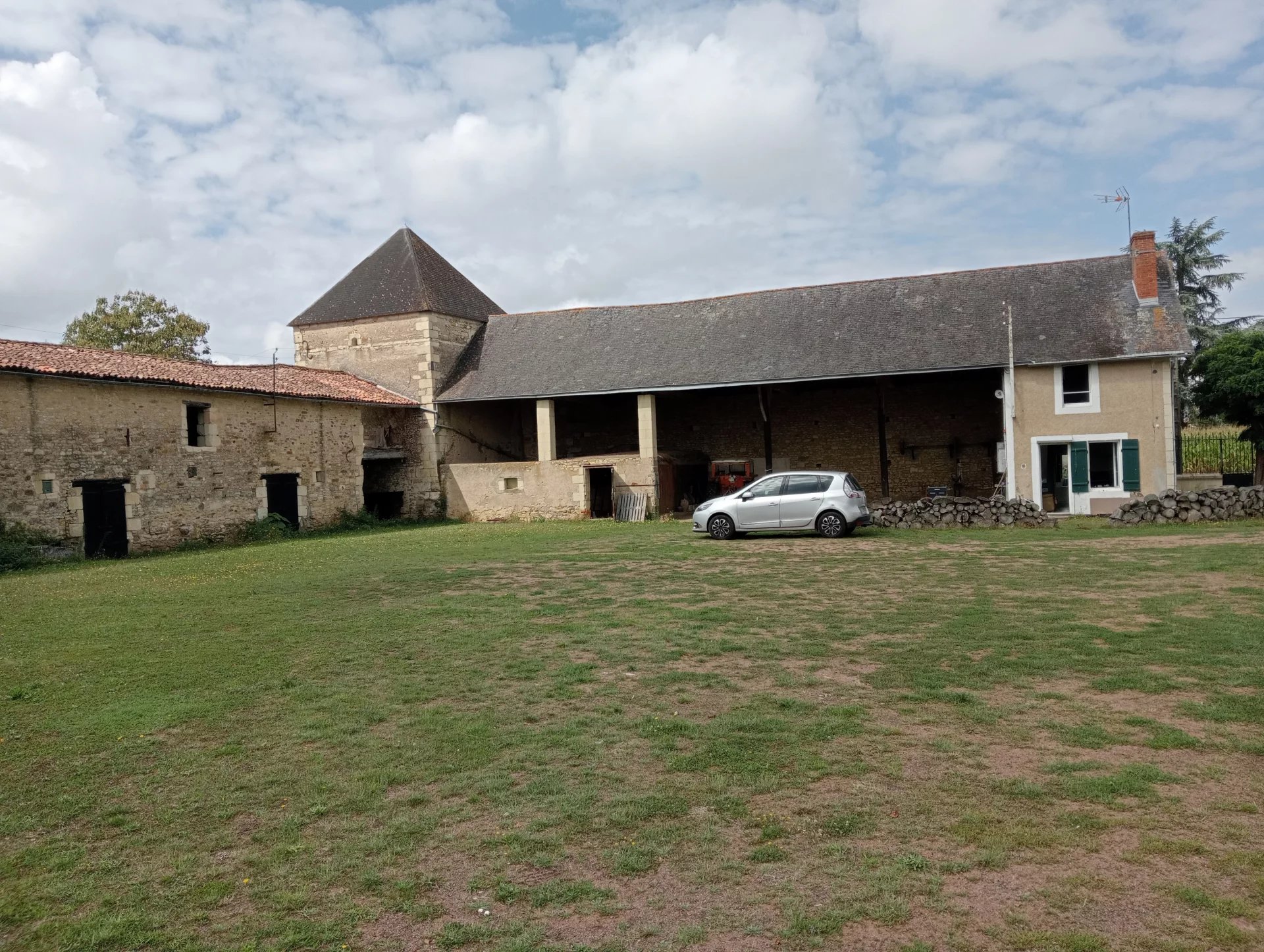 Small house with large outbuildings