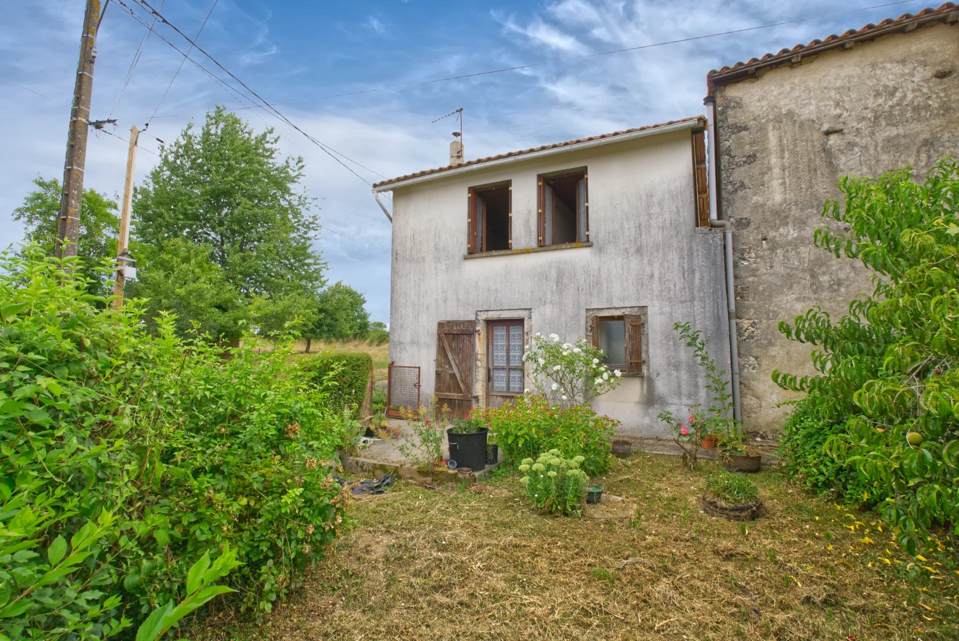 Small 2 bedroom country house in hamlet with outbuildings and land