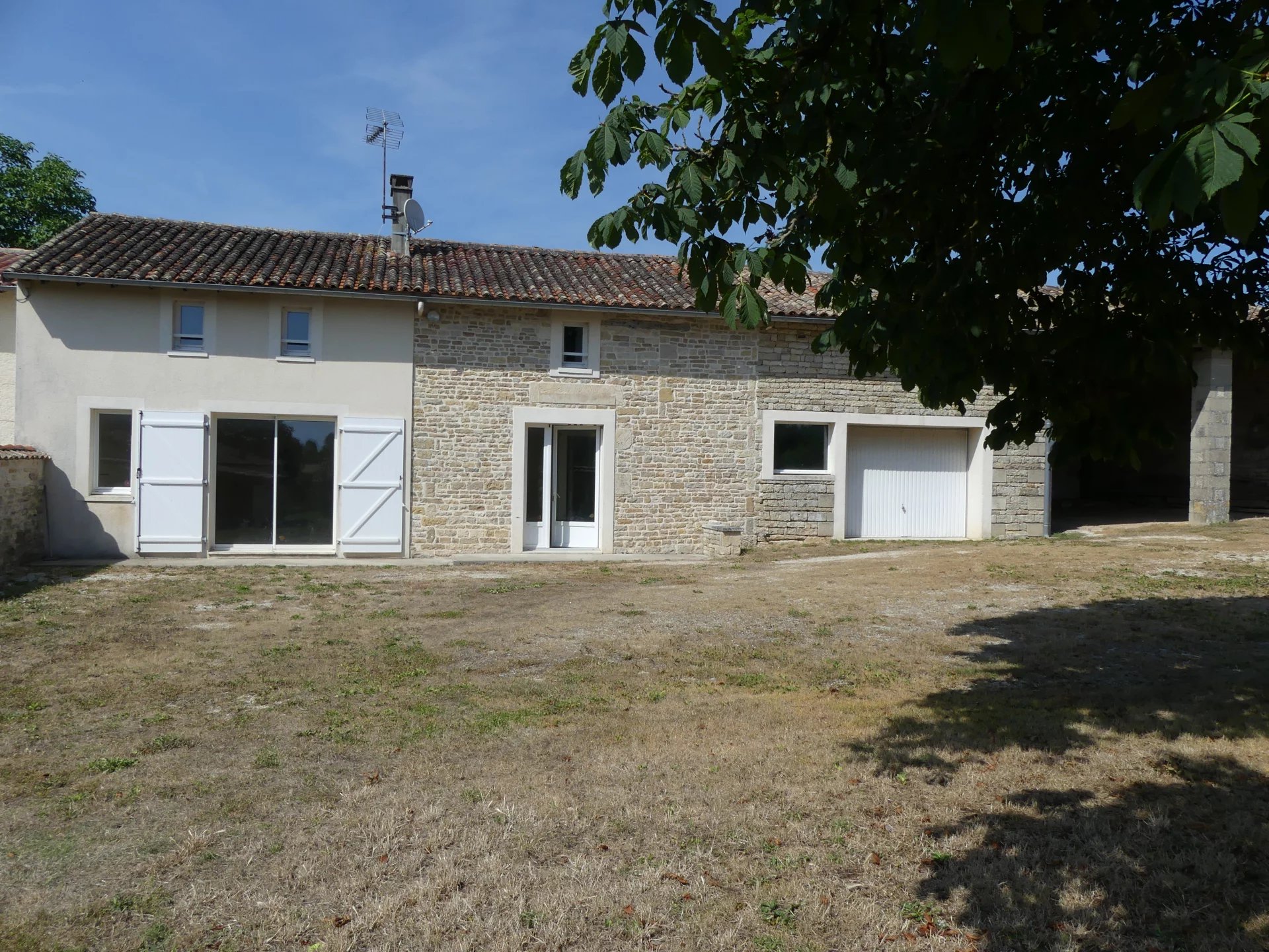 Pretty stone house with outbuildings and garden in quiet location