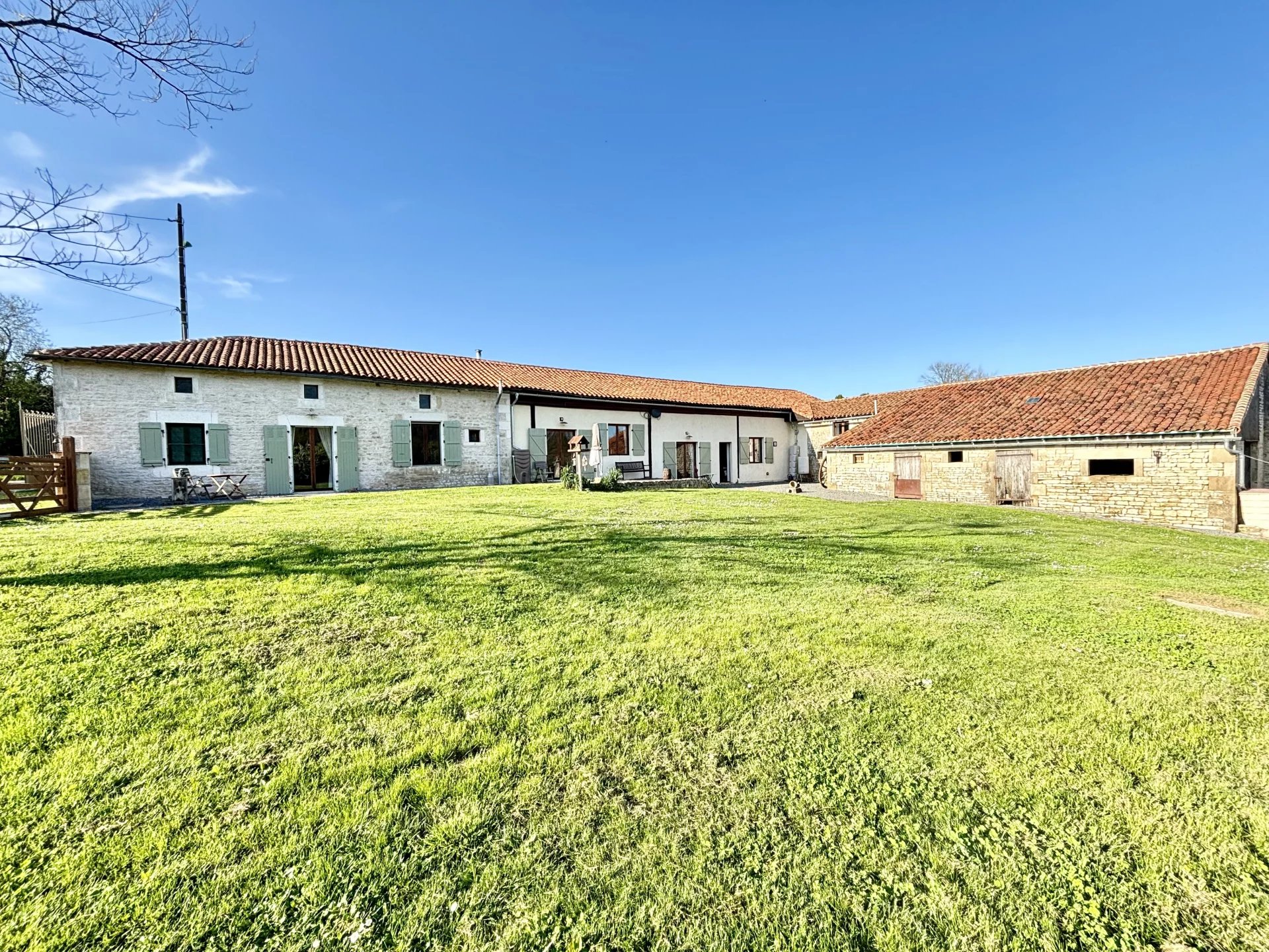 Spacious country home with fantastic living space, views, 2 barns and approx 1.5 acres of attached land