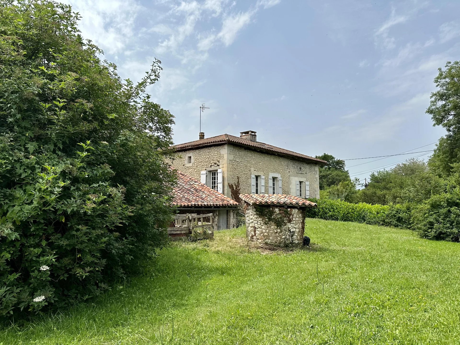 Character stone house with barn and garden