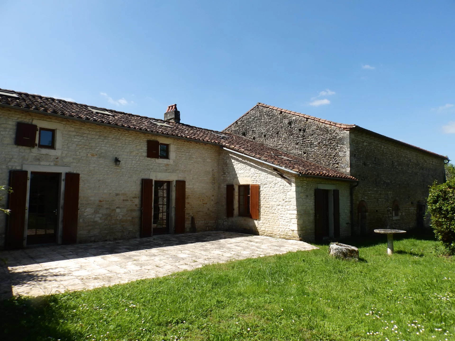 Traditional stone village house with outbuildings and large attached garden