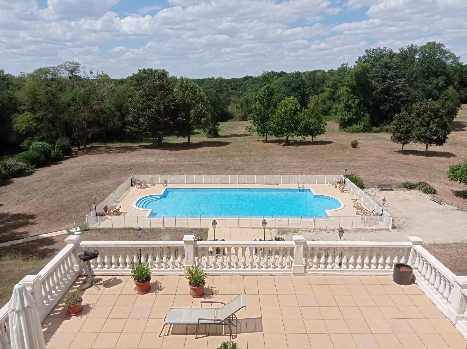 Two bedroom apartment in stunning chateau with swimming pool and land.