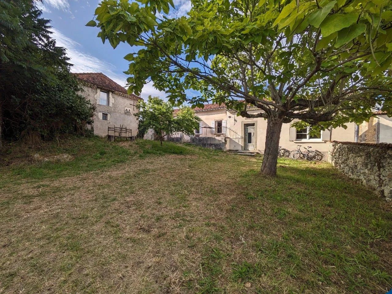 Traditional stone house with enclosed gardens and garage/workshop